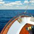 Blog Images for REgister your Vessel Blog Writing Sample depicting the bow of a yacht on the ocean with the sky in the horizon
